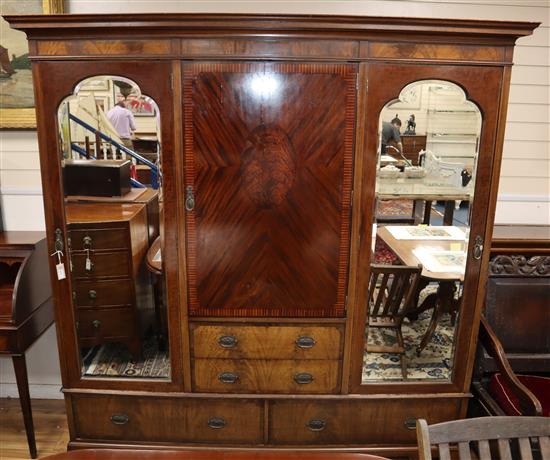 An Edwardian mahogany triple wardrobe W.212cm